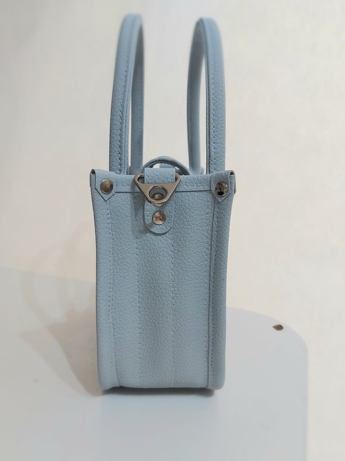 blue faux leather small essentials handbag and crossbody