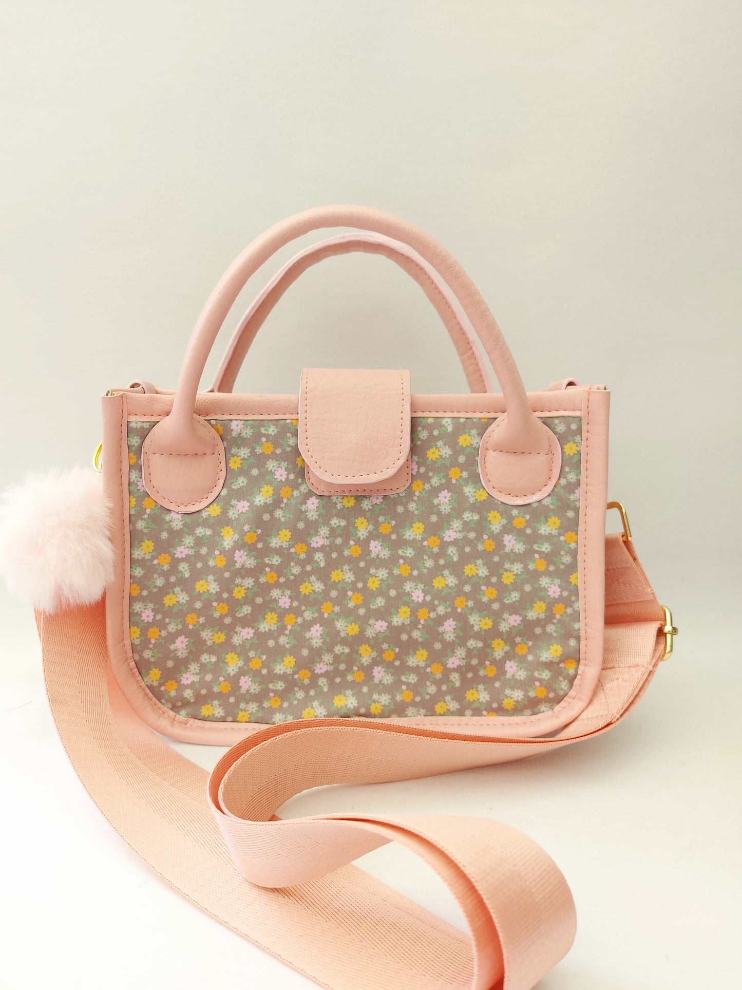 pink faux leather and floral small essentials handbag and crossbody