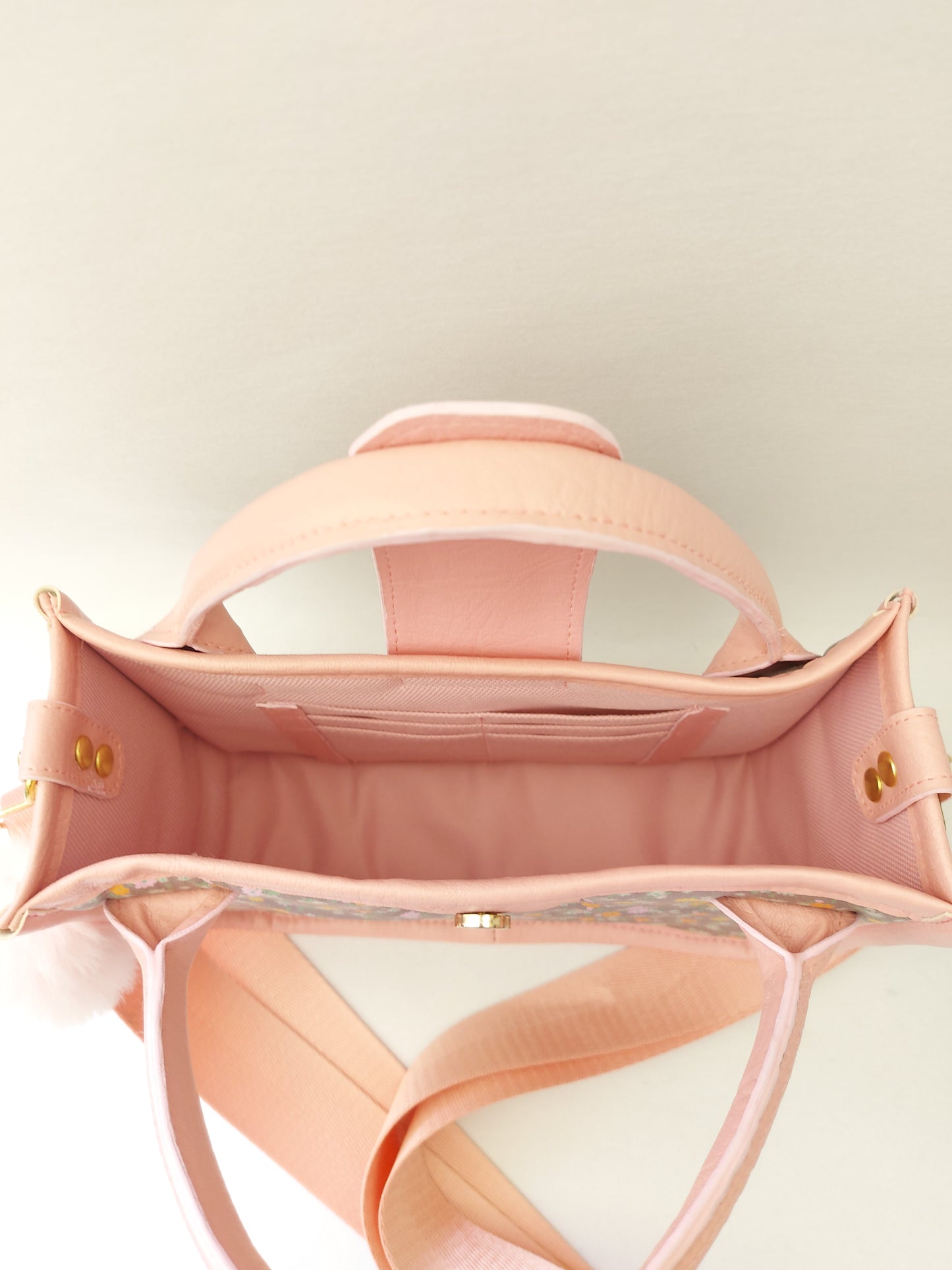pink faux leather and floral small essentials handbag and crossbody