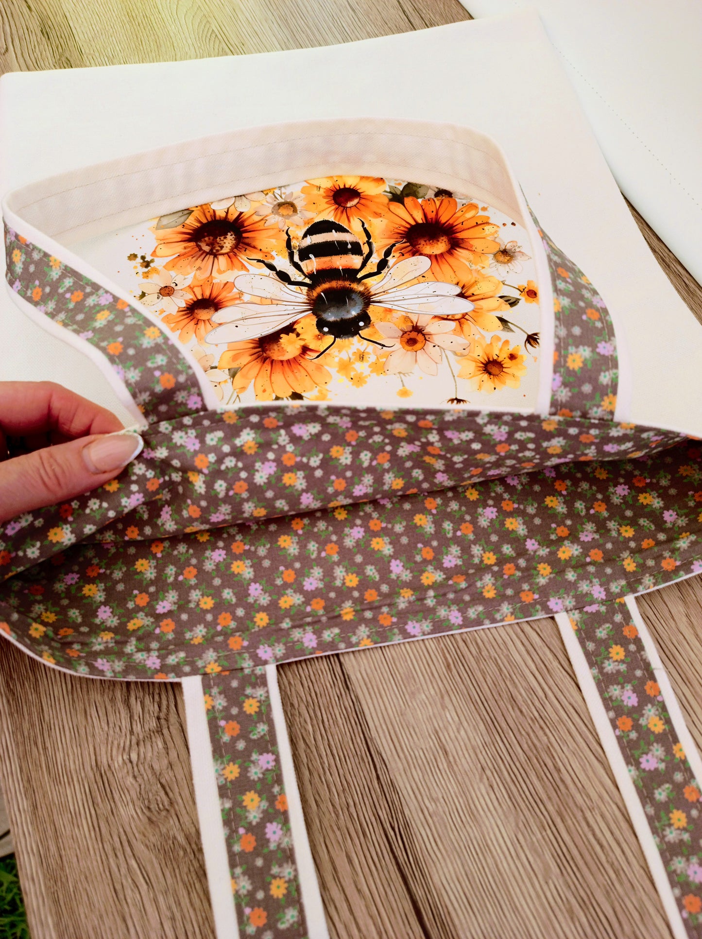Handmade canvas tote bag with bee and flowers transfers, floral lining, sturdy shoulder straps, perfect for everyday use or gifts.
