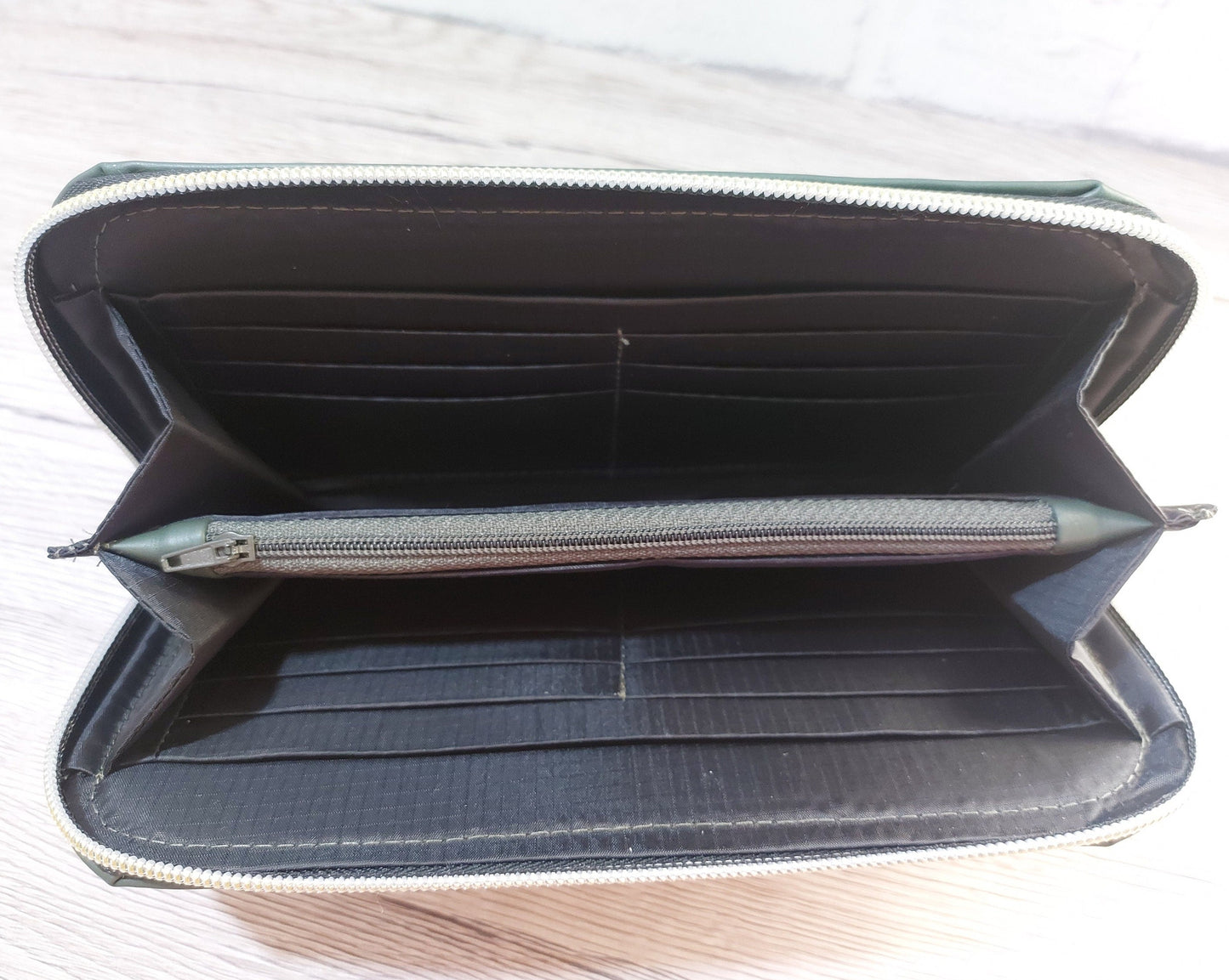 forest green faux leather large zip around women's wallet purse with card and cash slots and a zippered coin pouch, carry clutch