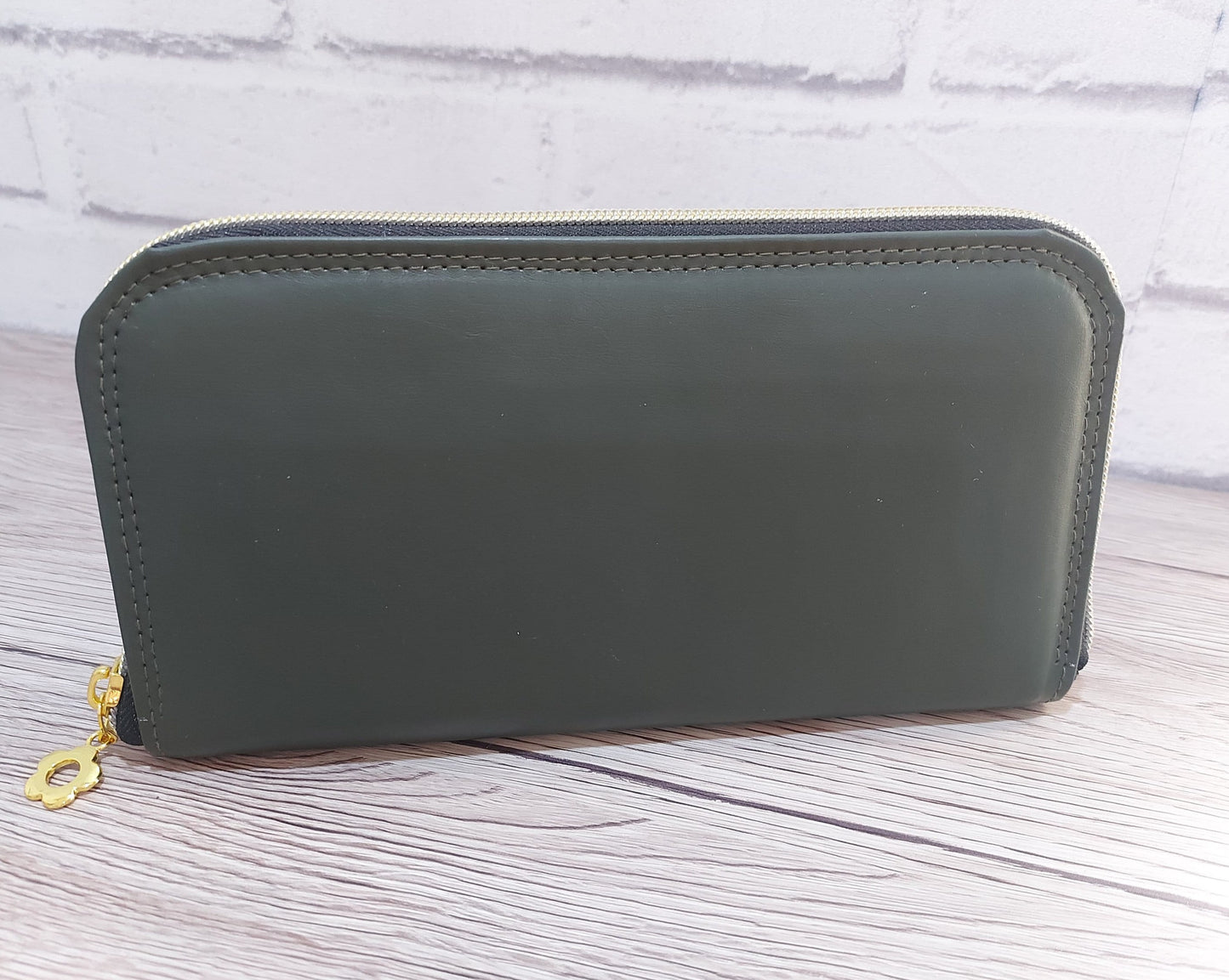 forest green faux leather large zip around women's wallet purse with card and cash slots and a zippered coin pouch, carry clutch