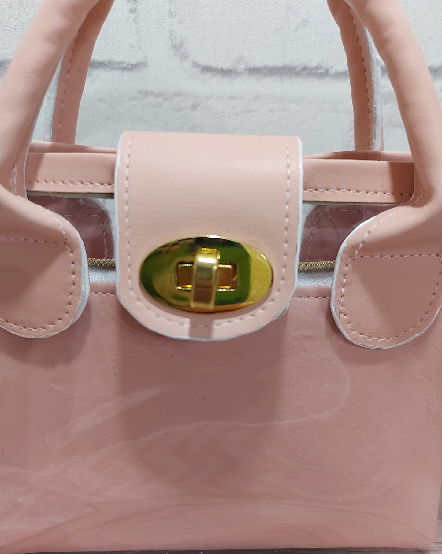 clear small bag with pink faux leather top handle and designer adjustable strap, days out nights out or work handbag, women and girls gift