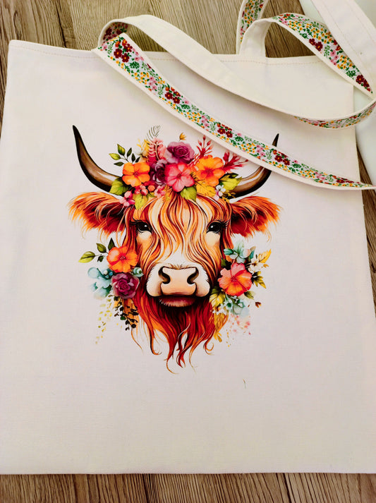 Handmade canvas tote bag with highland cow transfer picture, floral lining, sturdy shoulder straps, perfect for everyday use or gifts.